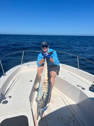 Fisherman holding large fish